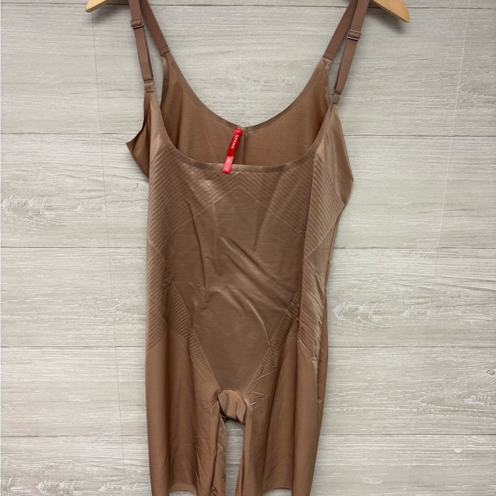 | SPANX | body suit. Size XL.